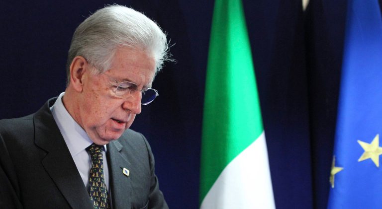   Italian Prime Minister Mario Monti prepares to take his place during a media conference after an EU summit in Brussels on Friday, Dec. 14, 2012. France and Germany have had more than their share of difference over the past few months, but this week at long last the two countries were able to find a compromise that allowed the European Union to realize a deal on a banking union. (AP Photo/Yves Logghe)  