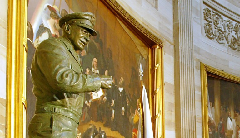 Indicating a statue of President Dwight D. Eisenhower in the Capitol Rotunda, House Minority Leader Nancy Pelosi, D-Calif., drew a sharp distinction between the former military leader and President Trump. (AP Photo/Rick Bowmer)