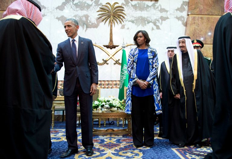Michelle Obama declined to wear a headscarf or veil Tuesday when in Saudi Arabia, and it's created a controversy on social media. (AP Photo)