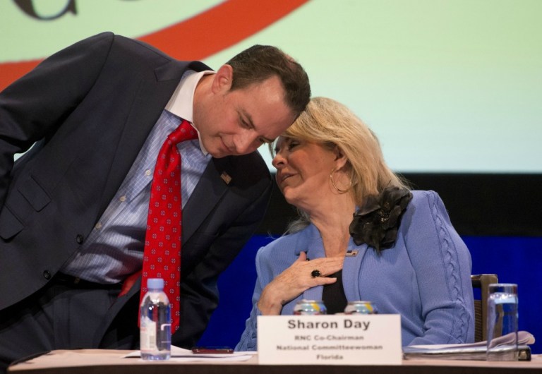 RNC chairman Reince Priebus and co-chair Sharon Day painted Hillary Clinton in an unflattering light in a statement released before she took the stage to celebrate her victory. (AP Photo)