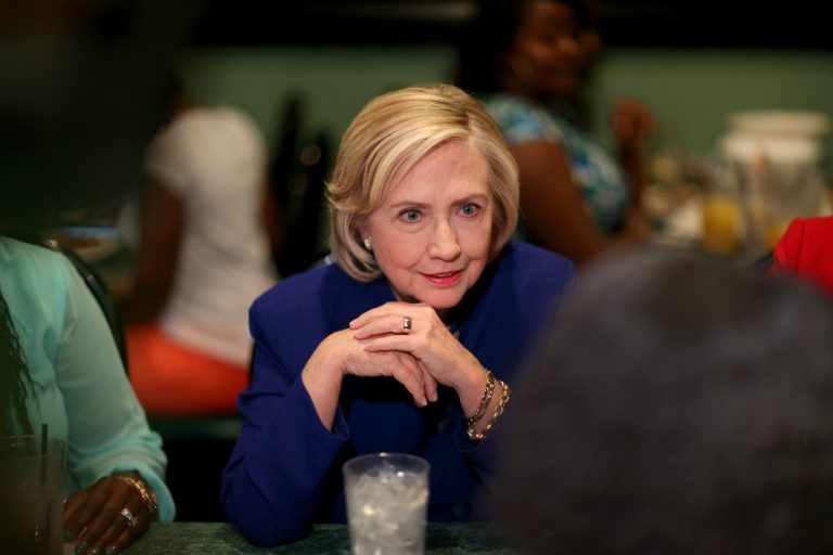 Democratic presidential candidate Hillary Clinton sits in on a round table discussion as she visits the Kikis Chicken and Waffles restaurant on May 27, 2015 in Columbia, S.C. (Photo by Joe Raedle/Getty Images)