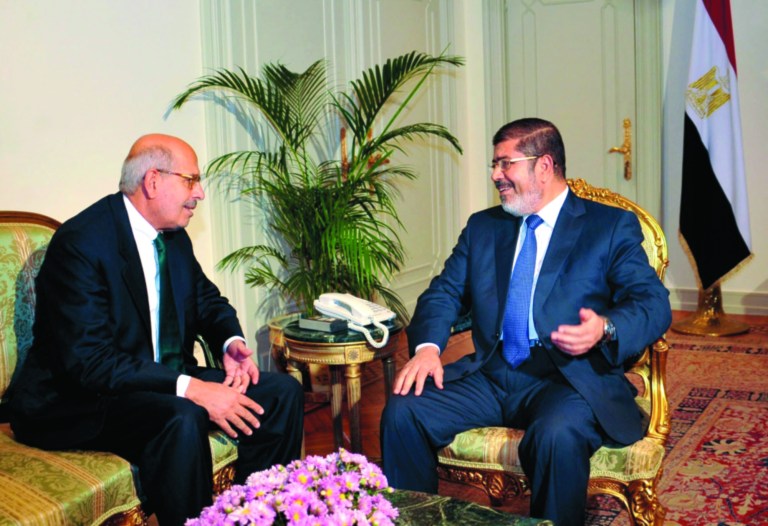 FILE - In this Tuesday, Nov. 13, 2012 file photo, released by the Egyptian Presidency, Nobel Peace Prize winner and head of the opposition Egyptian Constitution political party, Mohamed ElBaradei, left, meets with Egyptian President Mohammed Morsi, in Cairo, Egypt. An Egyptian opposition leader is calling for a boycott of upcoming parliamentary elections, a day after he said the vote will inflame the country's political tensions. Mohamed ElBaradei, who leads the main opposition National Salvation Front, wrote on Twitter Saturday, Feb. 23, 2013 that he is calling for the boycott 