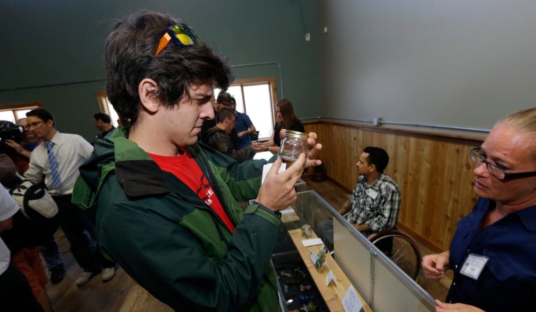 Sam Pyle, left, inspects a 