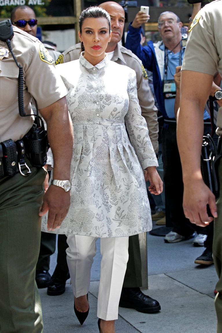TV personality Kim Kardashian leaves Los Angeles County Superior Court after a hearing in her divorce from Kris Humphries, Friday, April 12, 2013. Humphries, a power forward for the Brooklyn Nets, did not attend the hearing. The reality star wants a divorce to end her 72-day marriage to Humphries, but the NBA player wants it annulled. He claims the marriage was based on fraud, but he would have to approve the allegation at trial. Humphries' attorneys declined to comment on settlement discussions Friday but say a May 6 trial date remains. (AP Photo/Reed Saxon)