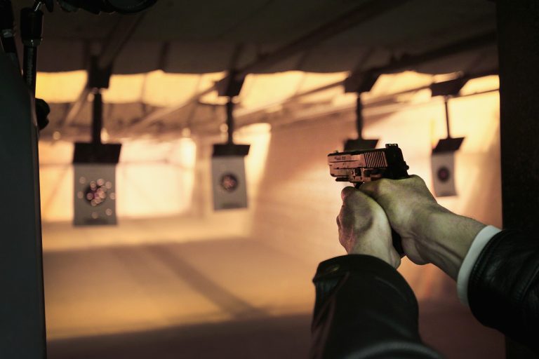 A marksman sights in on a target during a class he was taking to qualify for an Illinois concealed carry permit on February 14, 2014 in Posen, Ill. (Photo by Scott Olson/Getty Images File)