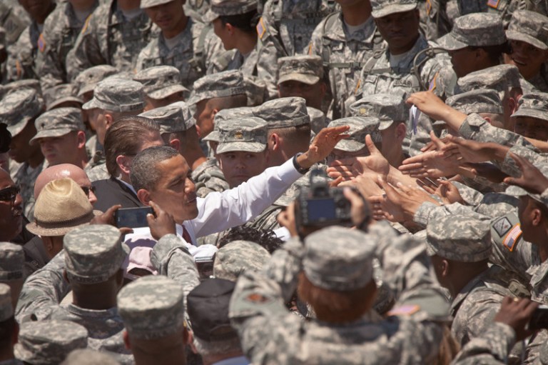 President Obama greets soldiers after signing an executive order requiring more disclosure by colleges at Fort Stewart army base on April 27, 2012 in Hinesville, Georgia. (Richard Ellis/Getty Images)