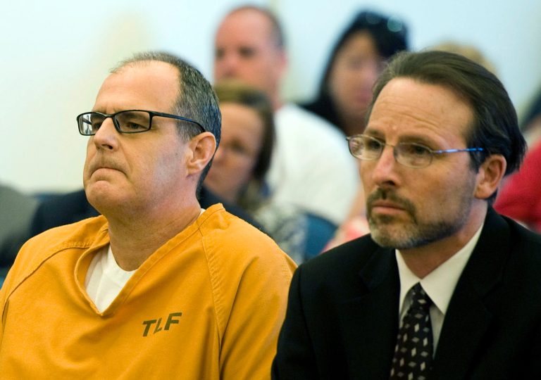 FILE - This May 2, 2014 file photo shows Scott Dekraai, left, sitting with his public defender Scott Sanders in Orange County Superior Court in Santa Ana, Calif. A judge is expected to rule Aug. 4, 2014, on a request to recuse the district attorney's office and strike the death penalty for  Dekraai  a man who killed eight people at a hair salon over allegations of prosecutorial misconduct and misuse of jailhouse informants. (AP Photo/The Orange County Register, Kevin Sullivan, File)   MAGS OUT; LOS ANGELES TIMES OUT