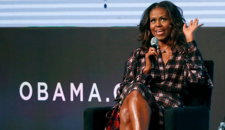 Former first lady Michelle Obama responds to a question from poet Elizabeth Alexander during the second day of the Obama Foundation Summit Wednesday, Nov. 1, 2017, in Chicago. (AP Photo/Charles Rex Arbogast)