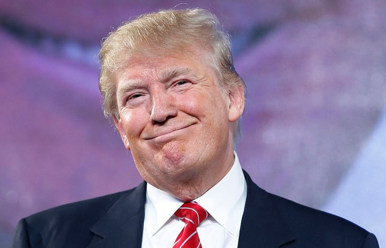 According to a Washington Post/ABC News poll released over the weekend, 96 percent of people who supported him in the election continue to do so now. (AP Photo/John Locher)