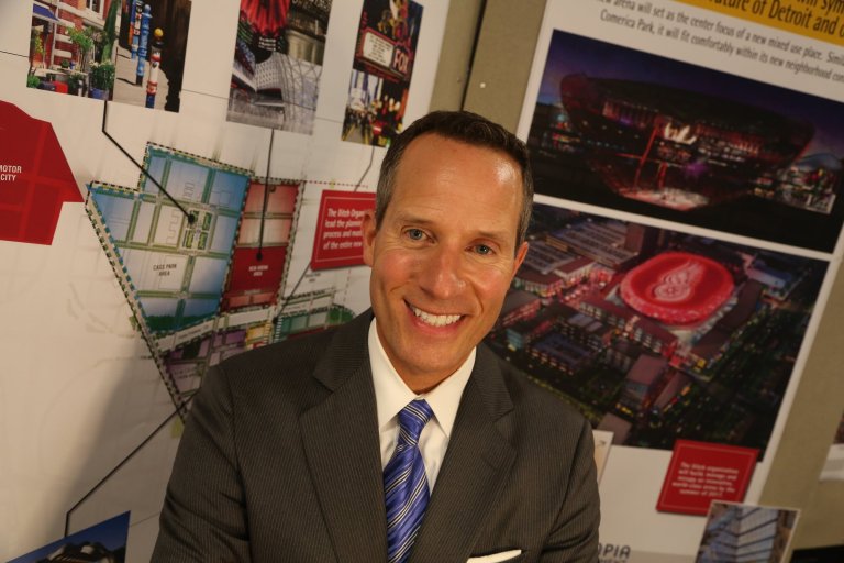 This July 17, 2014 photo shows Christopher Ilitch, the president and CEO of Ilitch Holdings  at the Fox Theatre in Detroit. The Ilitch family has unveiled more details of its plans for an entertainment and residential complex centered on a new Detroit Red Wings hockey arena.  (AP Photo/Detroit Free Press, Eric Seals)