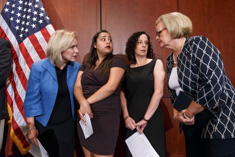 From left, Sen. Kirsten Gillibrand, D-N.Y., Anna, a survivor of sexual assault, with her mother Susan, and Sen. Claire McCaskill, D-Mo., talk to each other during a news conference on Capitol Hill in Washington, Wednesday, July 30, 2014, to discuss 