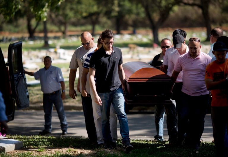 Relatives and friends carry the coffin of Genesis Carmona, in Valencia, Venezuela, Friday, Feb. 21, 2014. The university student and beauty queen was buried Friday in Valencia where she was slain during a political protest, a victim of what government opponents say is the kind of indiscriminate violence that has been used to stifle dissent across the country by supporters of President Nicolas Maduro. (AP Photo/Rodrigo Abd)