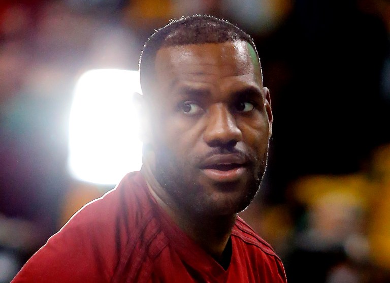 Twitter users want James to stop playing basketball until the feds reverse the grand jury's decision. (AP Photo/Winslow Townson)