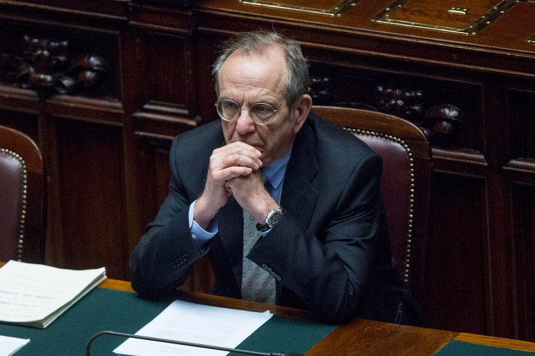 Italian Finance Minister Pier Carlo Padoan attends a Parliament session in Rome, Thursday, April 17, 2014.  Italy has again pushed back its balanced-budget goal, now aiming for 2016. Finance Minister Pier Carlo Padoan wrote to the European Commission this week, saying due to Italy's stubborn economic crisis, it is now aiming for a balanced structural budget in 2016. In 2011, then-Premier Silvio Berlusconi had promised that Italy would balance its budget by 2013. But with the country mired in recession, in 2012, during economist Mario Monti's government , the date was rolled back to 2015. The Senate Thursday approved the 2016 target. Padoan cited Italy's decision to accelerate payment of the remaining amount of public debt arrears as a key factor in the pushback. Many private businesses had said they risked failure if the government didn't pay what it owed them for services and goods. (AP Photo/Roberto Monaldo, LaPresse)