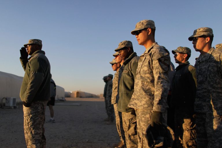 U.S. Army soldiers stand in formation as they prepare to leave Iraq on December 8, 2011 at Camp Virginia, near Kuwait City, Kuwait. (Photo by Joe Raedle / Getty Images)