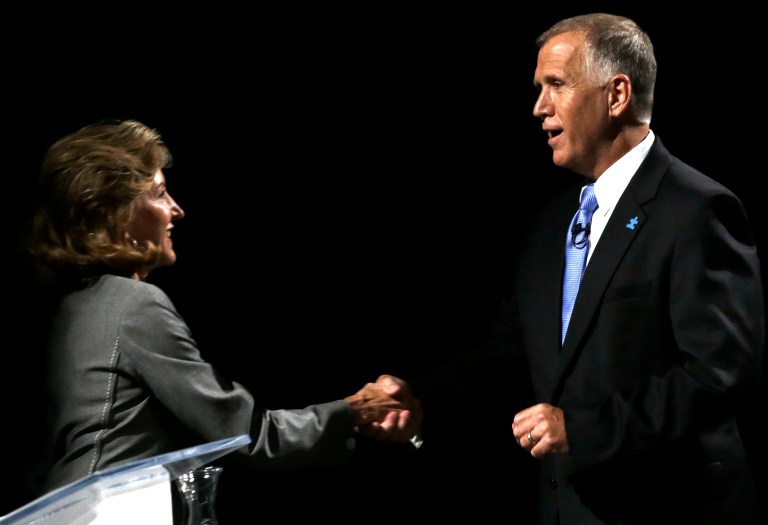 Sen. Kay Hagan, D-N.C., left, and Republican candidate for Senate Thom Tillis shake hands following a televised debate in Research Triangle Park, N.C., on Wednesday. (AP Photo/Gerry Broome)