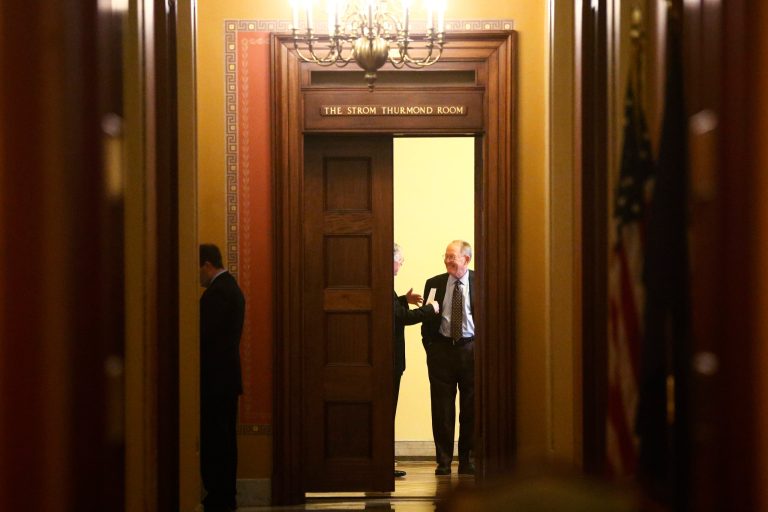 Sen. Lamar Alexander, R-Tenn., talks with Senate Minority Leader Mitch McConnell of Kentucky before Senate Republicans meet on Capitol Hill on Saturday. Senate Majority Leader Harry told reporters he, along with Sen. Chuck Schumer, D-N.Y., met with McConnell and Alexander this morning to talk about the debt ceiling and reopening the government. (AP Photo/Charles Dharapak)