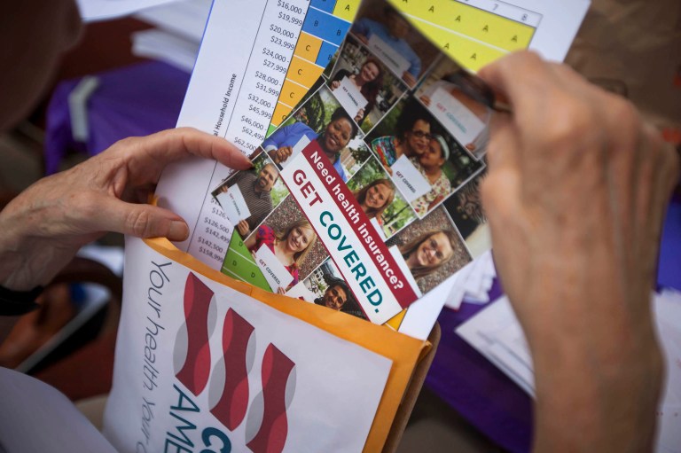 Total enrollment hit 12.7 million people, including new signups and renewals. (Michael Nagle/Bloomberg)