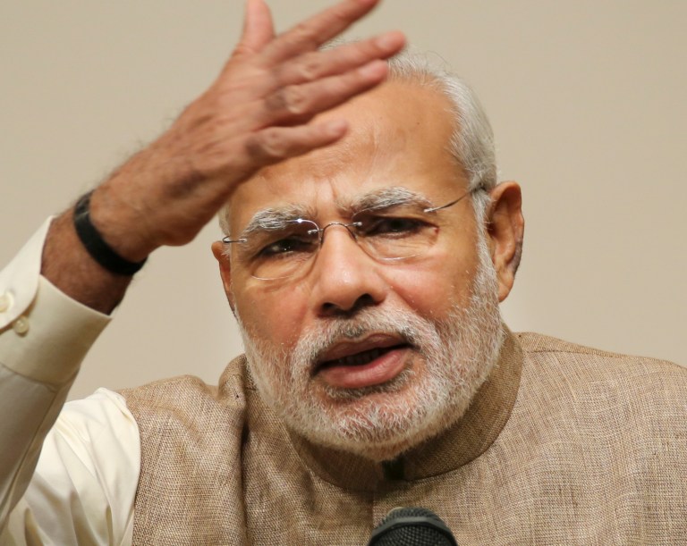 Indian Prime Minister Narendra Modi delivers a speech during his lecture at the University of the Sacred Heart in Tokyo, Tuesday, Sept. 2, 2014. Modi is currently on a five-day visit to Japan. (AP Photo/Koji Sasahara)