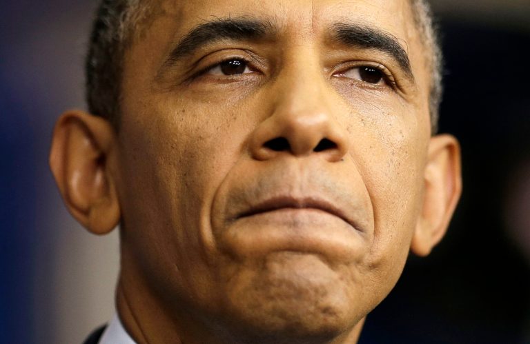 President Barack Obama pauses as he talks about the the budget and the partial government shutdown, Tuesday, Oct. 8, 2013, in the Brady Press Room of the White House in Washington. The president said he told House Speaker John Boehner he's willing to negotiate with Republicans on their priorities, but not under the threat of 
