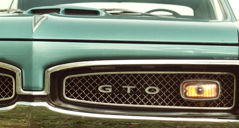   FILE- This Oct. 9, 2002 file photo shows the hood ornament of a 1967 Pontiac GTO in Sturtevant, Wis. Back when gas was cheap, Americans bought cars with V-8 engines like the Big Block, Cobra Jet and Ramcharger, but now, thanks to government regulation and gas-price gyrations, the motors that move the nationâs cars and trucks are shrinking. (AP Photo/Journal Times, Mark Hertzberg, file)  