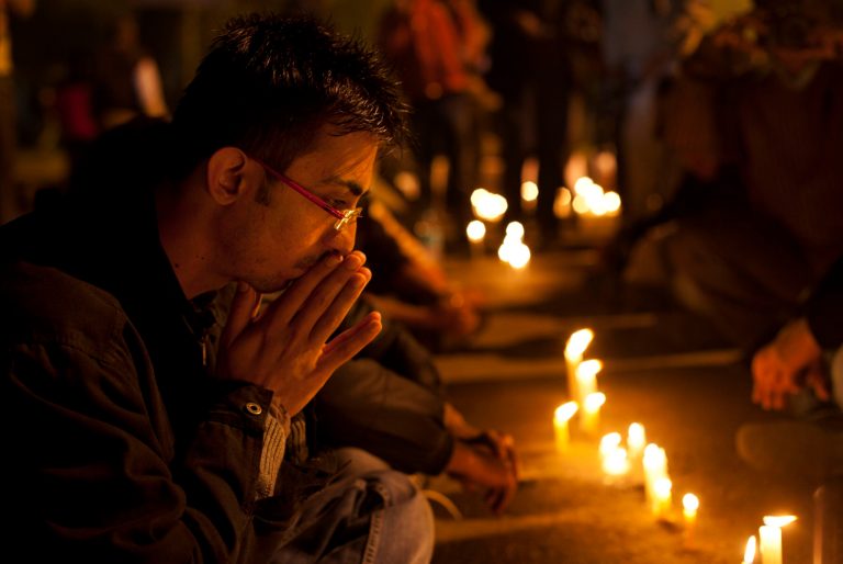   An Indian participates in a candle-lit vigil to mourn the death of a gang rape victim in New Delhi, India, Saturday, Dec. 29, 2012. Indian police charged six men with murder on Saturday, adding to accusations that they beat and gang-raped the woman on a New Delhi bus nearly two weeks ago in a case that shocked the country. The murder charges were laid after the woman died earlier Saturday in a Singapore hospital where she has been flown for treatment. (AP Photo/ Dar Yasin)  
