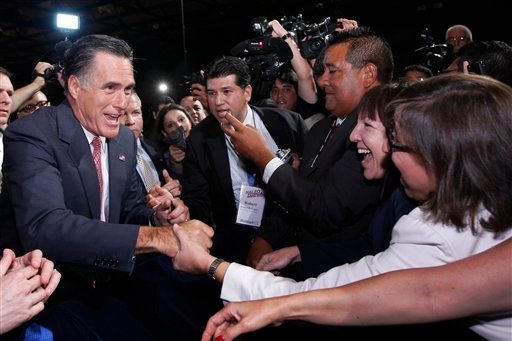 Romney greets attendees at the NALEO  conference in Orlando. (AP Photo/Charles Dharapak)