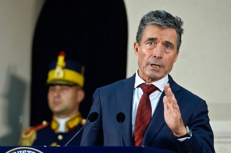 FILE - In this Friday, May 16, 2014, file photo, NATO Secretary General Anders Fogh Rasmussen speaks during a joint briefing with Romanian President Traian Basescu, at the Cotroceni presidential palace in Bucharest, Romania. Faced with a newly aggressive Russia, NATO has been mulling how to react, but it is ruling out one option: rapid expansion. (AP Photo/Octav Ganea, Mediafax, File) ROMANIA OUT