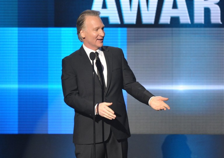 Bill Maher presents the Icon award on stage at the American Music Awards at the Nokia Theatre L.A. Live on Sunday, Nov. 24, 2013, in Los Angeles. (Photo by John Shearer/Invision/AP)