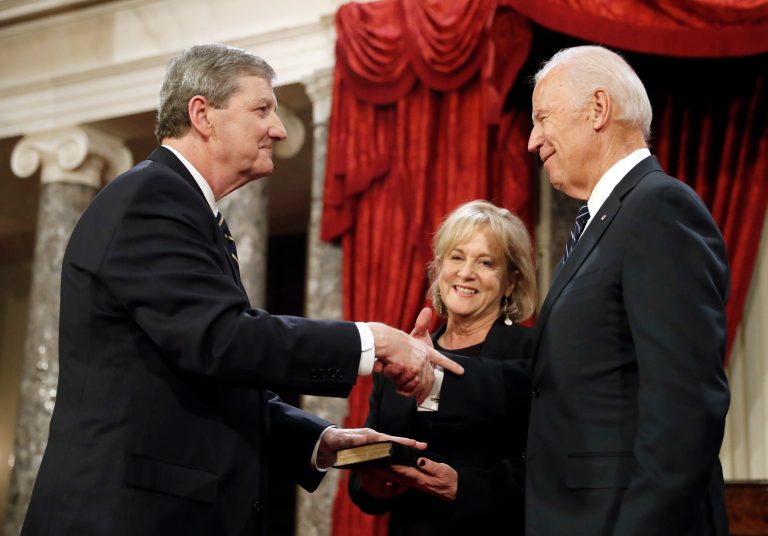 Vice President Joe Biden, right, shakes hands with Sen. John Kennedy, R-La., with his wife Becky Kennedy holding a bible, after administering the Senate oath of office during a mock swearing in ceremony in the Old Senate Chamber on Capitol Hill in Washington, Tuesday, Jan. 3, 2017, as the 115th Congress begins. The GOP hopes for even more wins in 2018. (AP Photo/Alex Brandon)