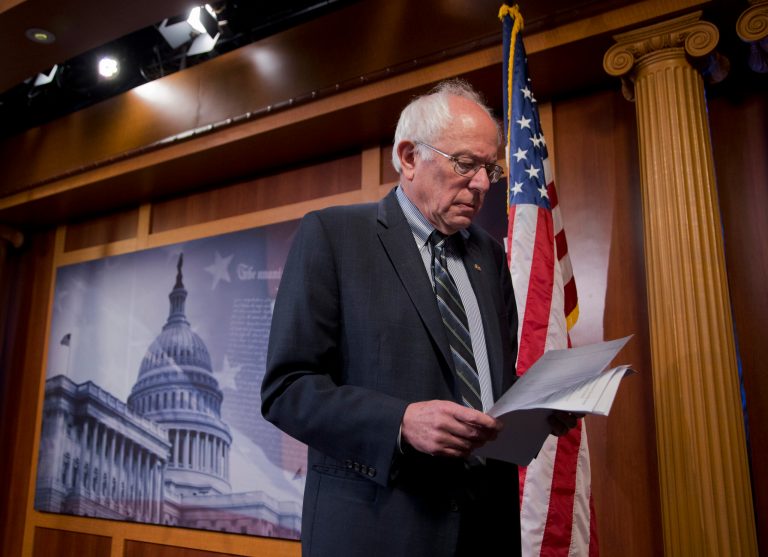 Democratic presidential candidate, Sen. Bernie Sanders, I-Vt., reads papers prior to estate tax reform news conference, Thursday, June 25, 2015, on Capitol Hill in Washington. (AP Photo/Manuel Balce Ceneta)