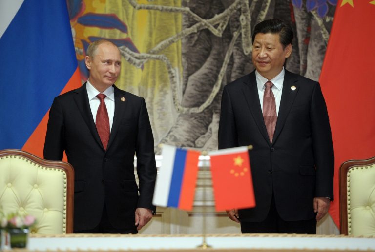 Russia's President Vladimir Putin, and China's President Xi Jinping, right, smile during signing ceremony in Shanghai, China on Wednesday, May 21, 2014. China signed a long-awaited, 30-year deal Wednesday to buy Russian natural gas worth some $400 billion in a financial and diplomatic boost to diplomatically isolated President Vladimir Putin. (AP Photo/RIA Novosti, Alexei Druzhinin, Presidential Press Service)