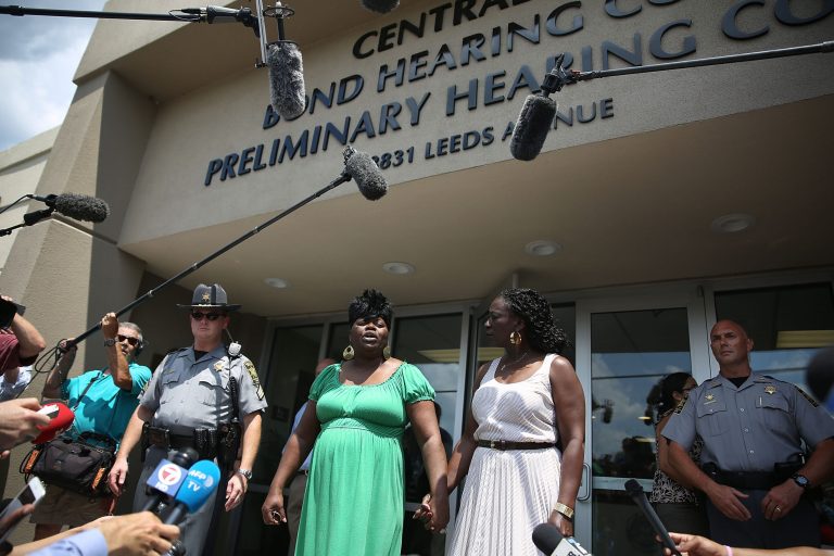 Nadine Collier (L) speaks to the media outside of the Centralized Bond Hearing Court Preliminary Hearing Court where she attended the bond hearing for Dylann Roof who is accused of killing her mother, Ethel Lance, and nine others during a shooting at the Emanuel African Methodist Episcopal Church on June 19, 2015 Charleston, South Carolina. (Photo by Joe Raedle/Getty Images)