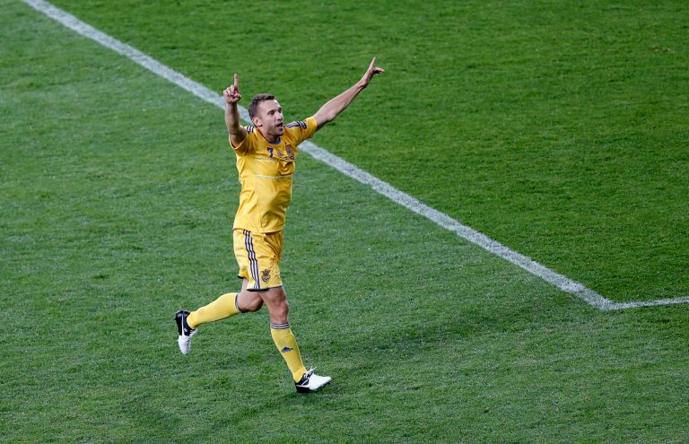   Ukraine double scorer Andriy Shevchenko celebrates winning 2-1 after the Euro 2012 soccer championship Group D match between Ukraine and Sweden in Kiev, Ukraine, Monday, June 11, 2012. (AP Photo/Darko Vojinovic)  
