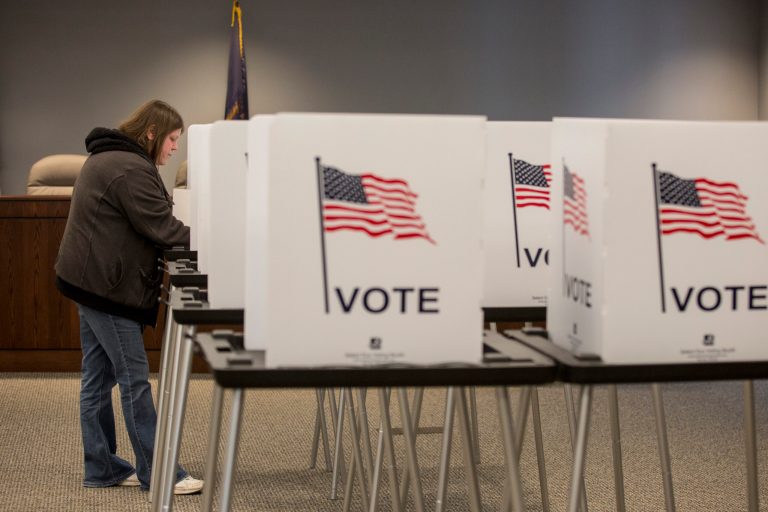 Danielle Jackson fills out her ballot during the primary election at the Fort Gratiot Township Hall on Tuesday, March 8, 2016 in Fort Gratiot, Mich.   Presidential candidates in both parties were looking to Michigan on Tuesday for one of the largest delegate hauls in the bruising nominating contests.  (Jeffrey M. Smith/The Times Herald via AP)  NO SALES; MANDATORY CREDIT