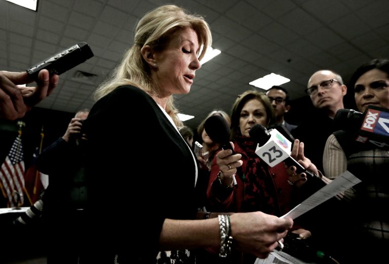 Texas Sen. Wendy Davis reads her education proposals to reporters after a meeting in Arlington, Texas, Thursday, Jan. 9, 2014. (AP Photo/LM Otero)