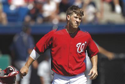 Paul Sancya/AP
Bryce Harper struck out in his first four at-bats against the Tigers before the Nationals optioned him to Triple-A Syracuse.