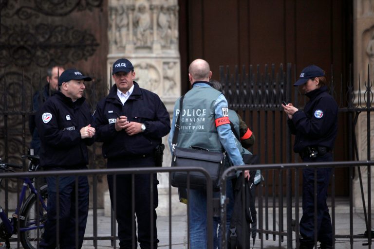 A forensic team arrive at the Notre Dame Cathedral after a man committed suicide, in Paris, Tuesday, May 21, 2013. Notre Dame has been evacuated after a man committed suicide in the 850-year-old monument and tourist attraction. (AP Photo/Thibault Camus)