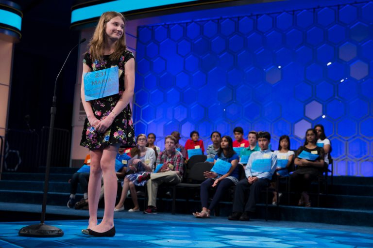 Maria Kaltchenko of Tupelo, Miss., smiles after spelling the word 