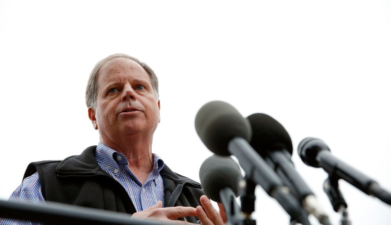 Sen. Cory Booker, D-N.J., and Rep. John Lewis, D-Ga., among others, are set to speak at Alabama State University on Saturday in a get-out-the-vote effort aimed at getting black voters to turn out for Doug Jones (pictured above) on Tuesday's election day. (AP Photo/Brynn Anderson)