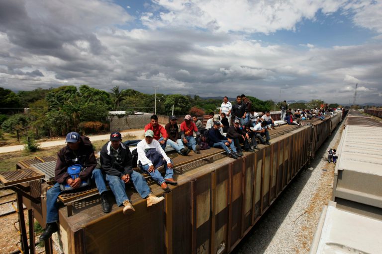 Migrants ride on top of a northern bound train toward the US-Mexico border in Ixtepec, in Oaxaca, southern Mexico, Thursday, March 10, 2011. (AP Photo/Eduardo Verdugo)