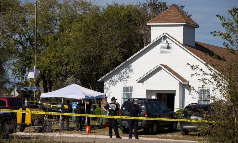 Law enforcement officials works at the scene of a fatal shooting at the First Baptist Church in Sutherland Springs, Texas, on Sunday, Nov. 5, 2017. (Nick Wagner/Austin American-Statesman via AP)