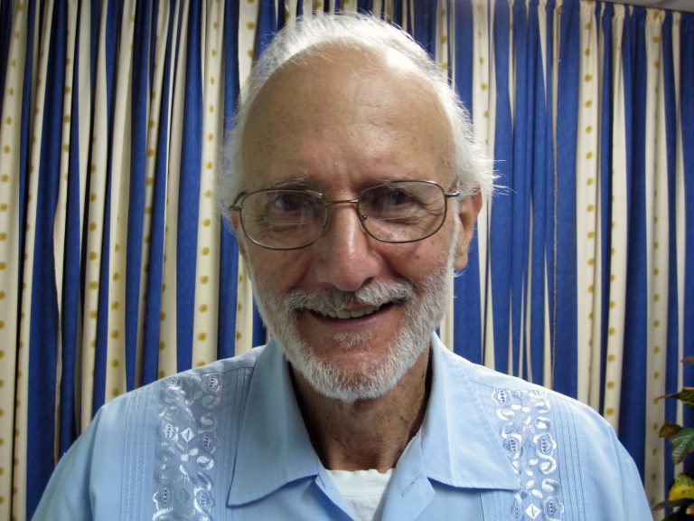 FILE - In this Nov. 27, 2012 file photo provided by James L. Berenthal, jailed American Alan Gross poses for a photo during a visit by Rabbi Elie Abadie and U.S. lawyer James L. Berenthal at Finlay military hospital as he serves a prison sentence in Havana, Cuba. Scott Gilbert, Gross' attorney said Wednesday, April 23, 2014, that Gross is suffering a number of ailments. On May 2, Gross will turn 65 years old. (AP Photo/James L. Berenthal, File)