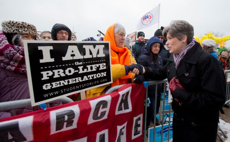 Sen. Joni Ernst, R-Iowa, right, greets, Ann Marie Bowen, of Omaha, Neb., and anti-abortion supporters, during the March for Life 2016 rally, commemorating the anniversary of 1973 