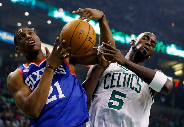   Philadelphia 76ers' Thaddeus Young (21) and Boston Celtics' Kevin Garnett (5) vie for a rebound in the first quarter of an NBA basketball game in Boston, Saturday, Dec. 8, 2012. (AP Photo/Michael Dwyer)  