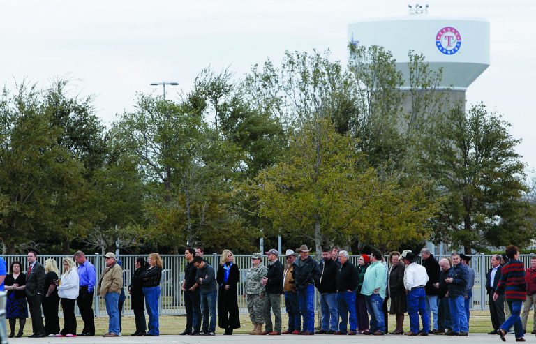 People wait in line to attend a memorial service for Christopher Kyle at Cowboys Stadium, Monday, Feb. 11, 2013, in Arlington, Texas. Thousands are expected to attend the public memorial service for Kyle, the former Navy SEAL sniper who was shot to death at a Texas shooting range. (AP Photo/Brandon Wade)