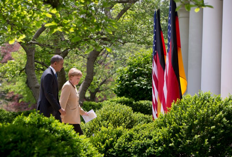 President Barack Obama and German Chancellor Angela Merkel walk to the Oval Office of the White House in Washington, Friday, May 1, 2014, after their joint news conference in the Rose Garden. Obama and Merkel are putting on a display of trans-Atlantic unity against an assertive Russia, even as sanctions imposed by Western allies seem to be doing little to change Russian President Vladimir Putin's reasoning on Ukraine. (AP Photo/Carolyn Kaster)