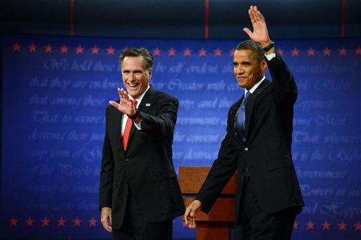 President Barack Obama and former Massachusetts Governor Mitt Romney wave at the start of the presidential debate at the University of Denver Wednesday, Oct. 3, 2012, in Denver. (AP Photo/The Denver Post, John Leyba) MAGS OUT; TV OUT; INTERNET OUT