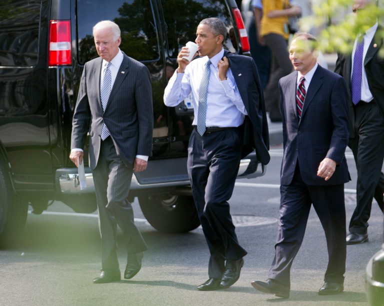 President Barack Obama, center, and Vice President Joe Biden, left, walk with Procter and Gamble executive Robert McDonald, Obama's nominee as the next Veterans Affairs secretary, from the Department of Veterans Affairs back to the White House in Washington, Monday, June 30, 2014. If confirmed by the Senate, McDonald would succeed Eric Shinseki, the retired four-star general who resigned last month as the scope of the issues at veterans' hospitals became apparent.  (AP Photo/Manuel Balce Ceneta)