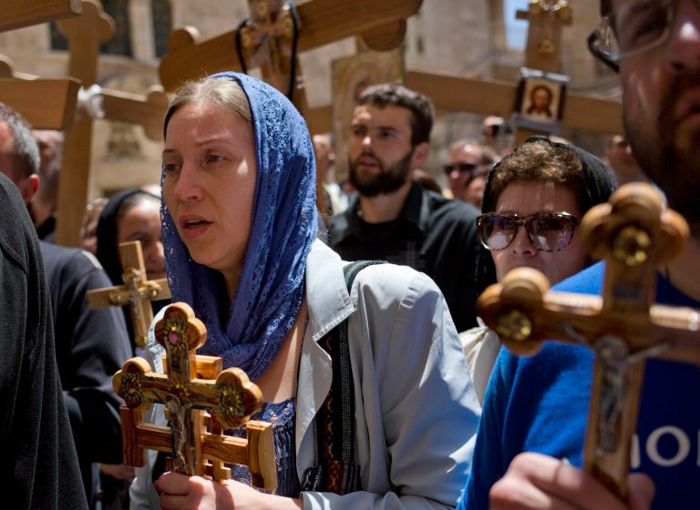 Pilgrims carry crosses during Good Friday in Jerusalem Friday, April 18, 2014, as Christians commemorated  the crucifixion of Jesus Christ.(AP Photo/Dusan Vranic)